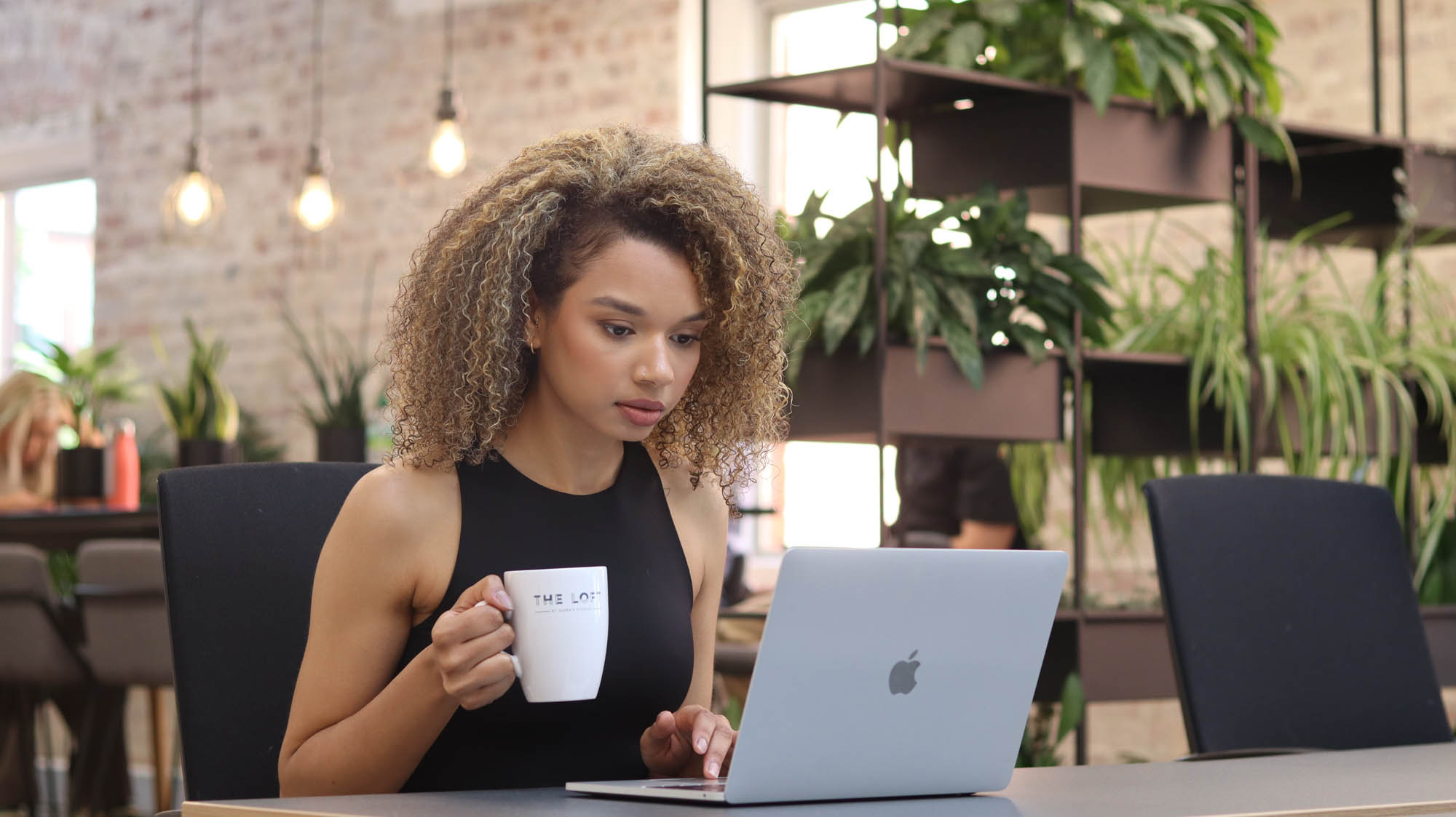 Woman working in coworking space in The Loft, Queen's Park