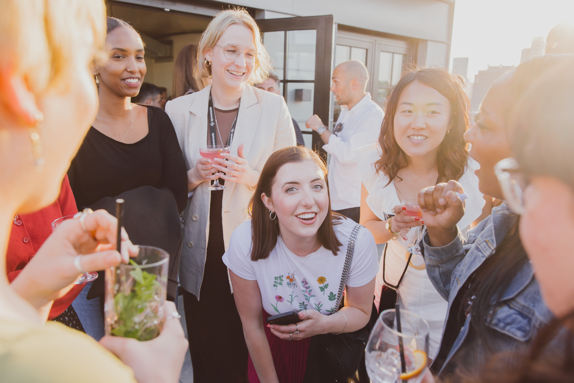 A group of people chatting and laughing